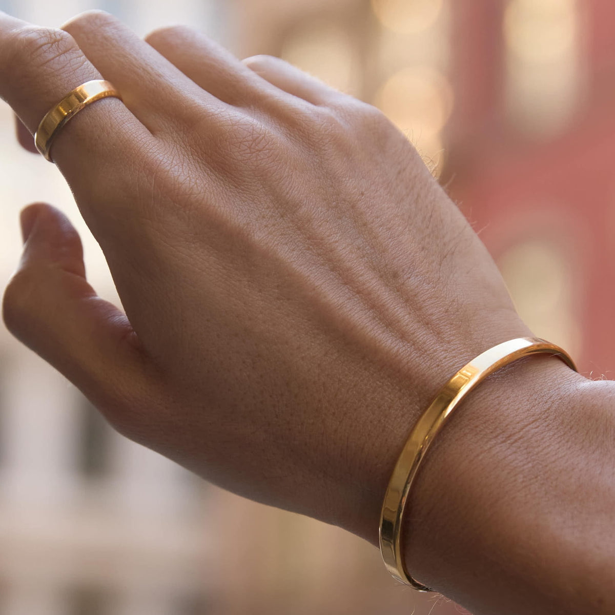 Classic Unisize Ring - gold-toned minimalist bangle worn wrist
