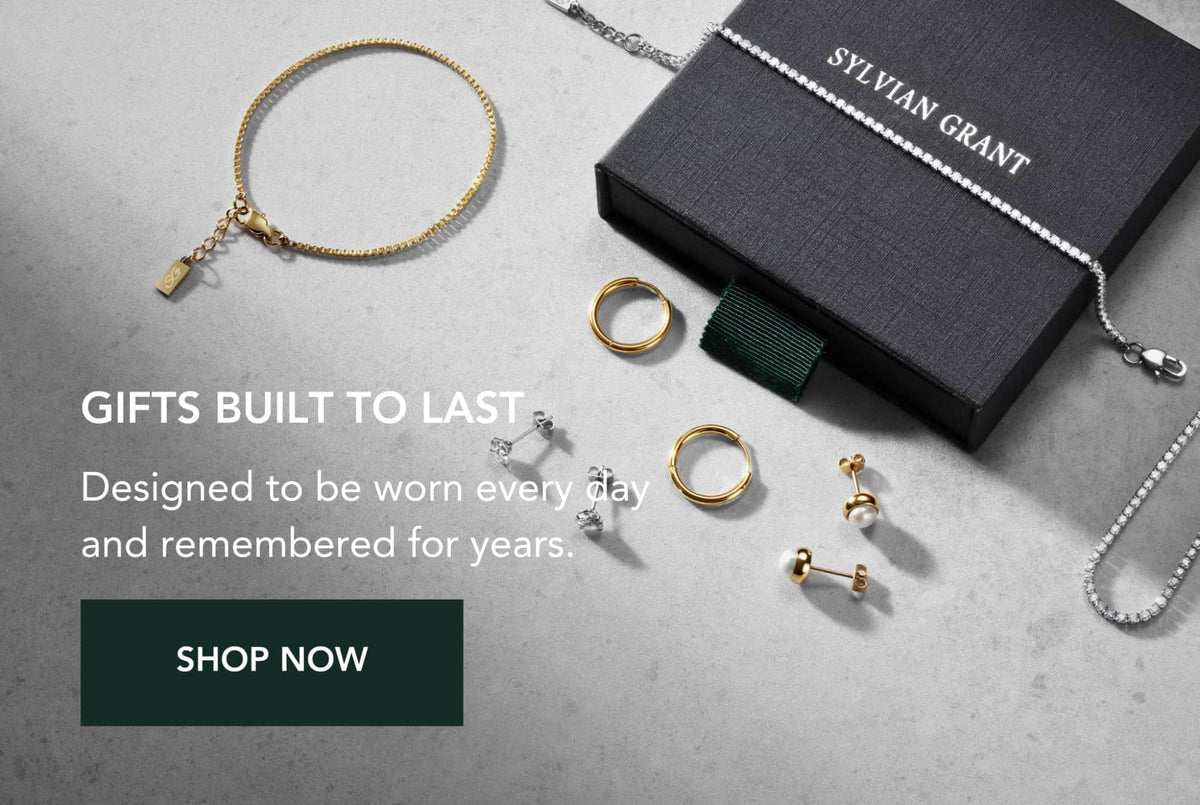 Gold chain bracelet with a small rectangular tag charm