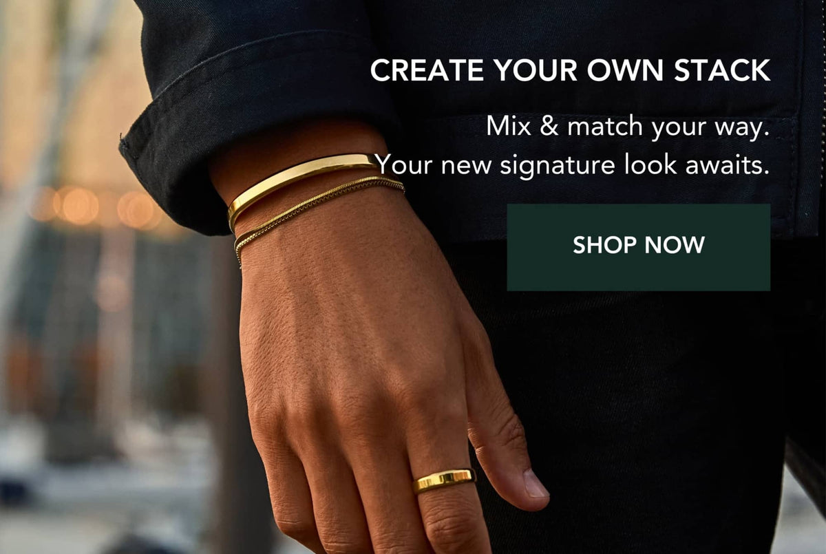 Gold-toned minimalist stackable bracelets and a matching ring, featuring sleek metallic bands with subtle texture.