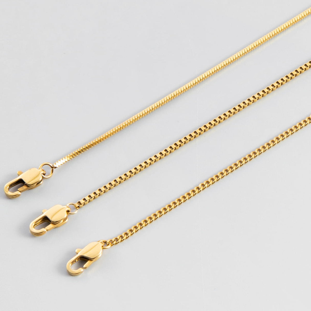 Minimal Bracelet Stack - Gold - three gold-colored necklaces chain styles