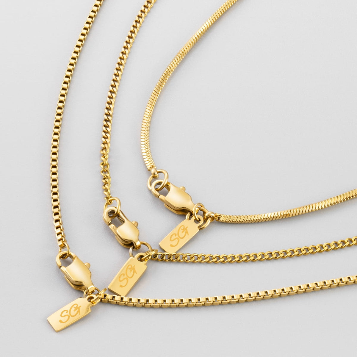 Minimal Chain Stack - Gold - three gold-toned necklaces distinct chain