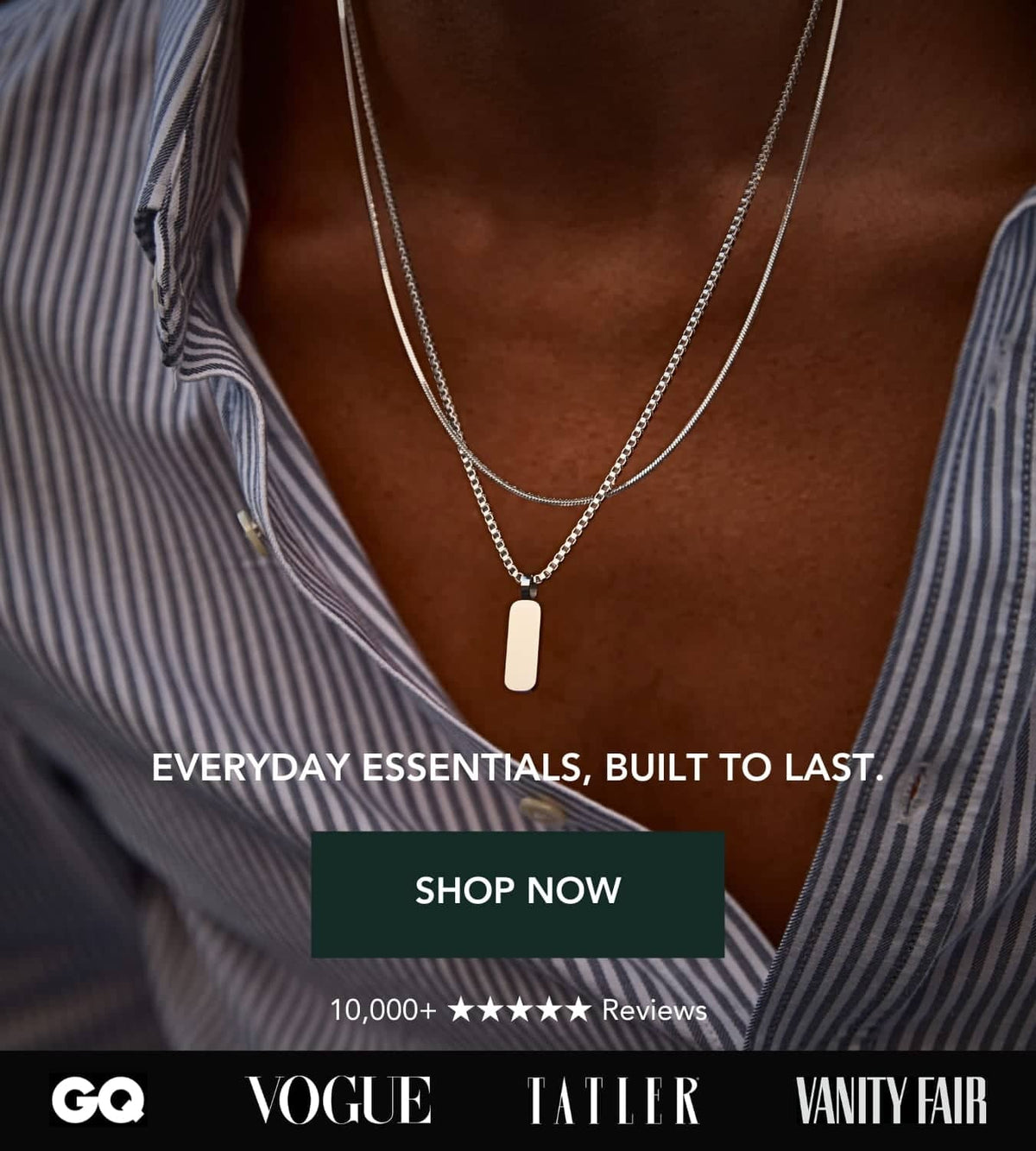 Silver dog tag pendant on a delicate chain, layered with another fine silver chain.
