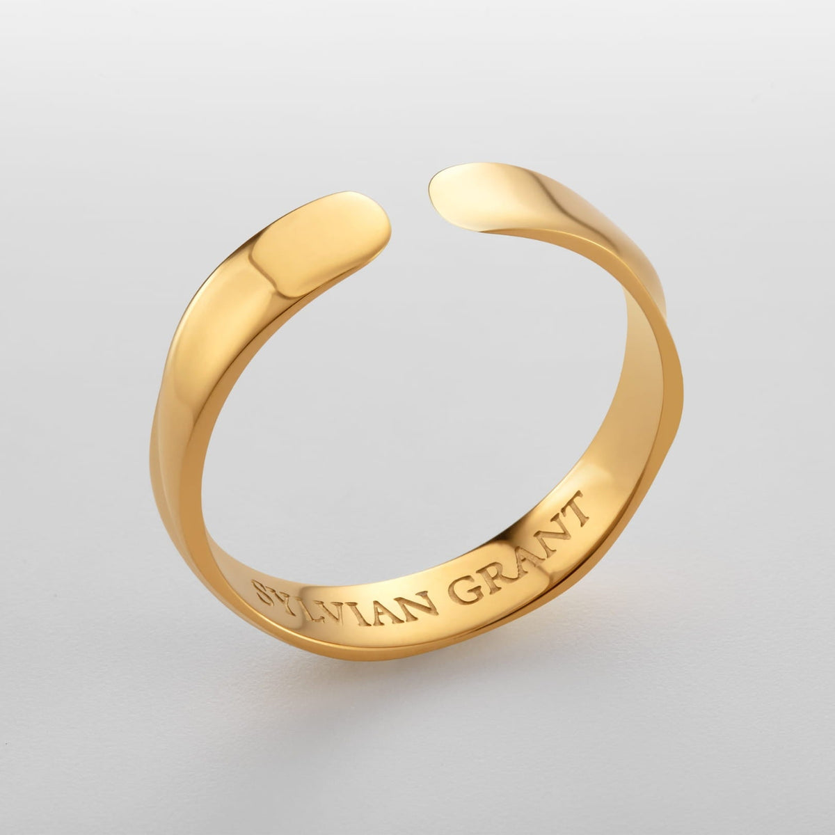 Twisted Unisize Ring - sleek gold-toned adjustable ring smooth