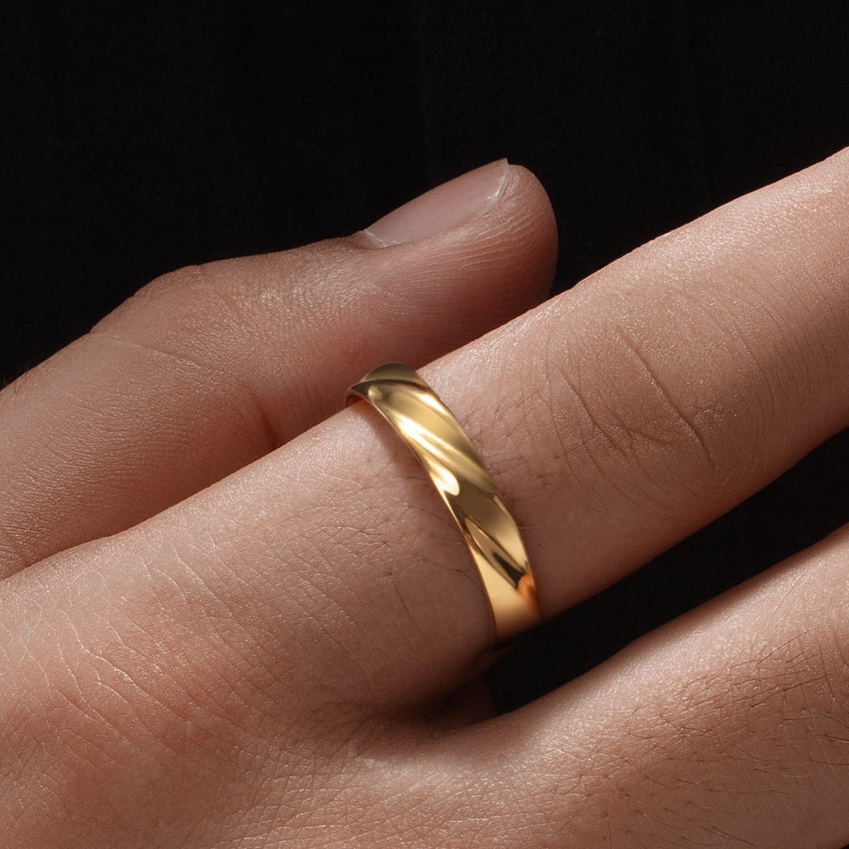 Twisted Unisize Ring - sleek gold-toned ring twisted band