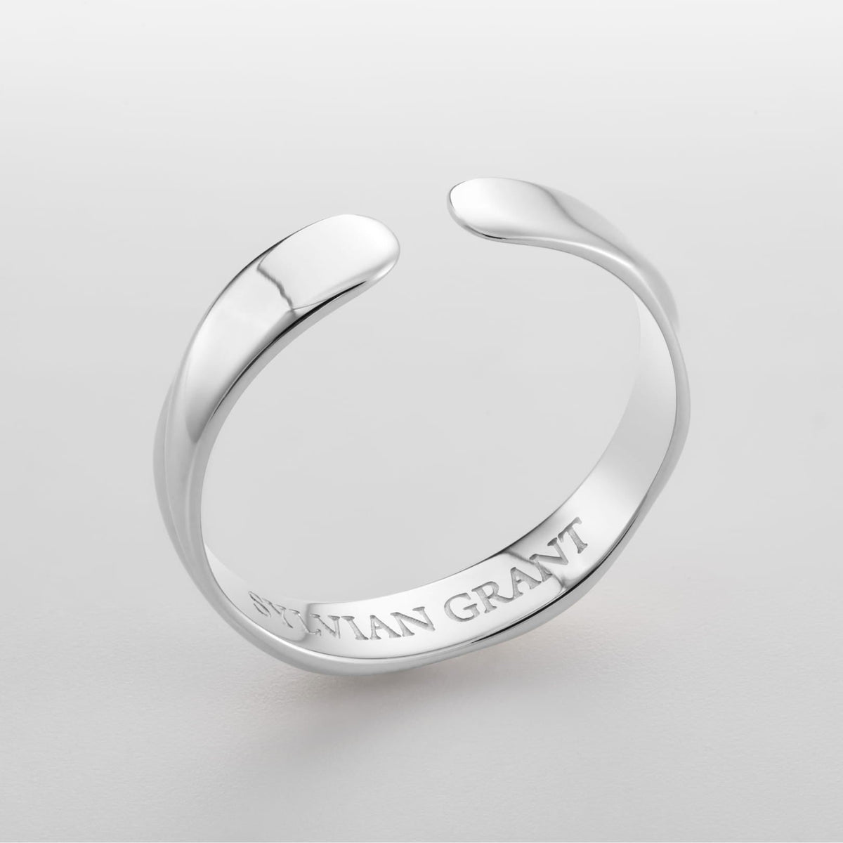 Twisted Unisize Ring - sleek silver-toned open ring smooth